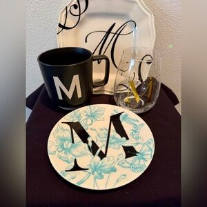 4 Letter M serveware. 2 plates, coffee my and stemless wine glass.
